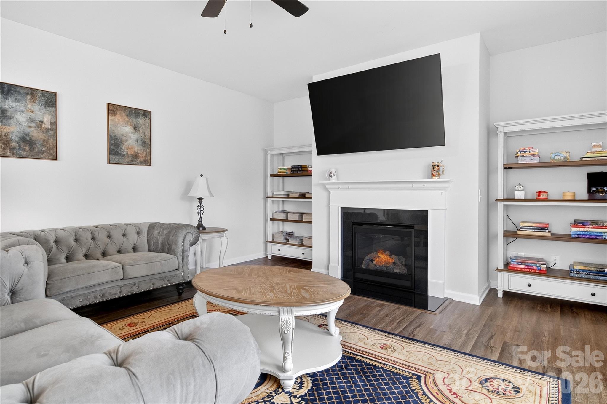 151 Outrigger Lane Troutman, NC 28166 - Photo 20 of 39 a living room with furniture and a fireplace