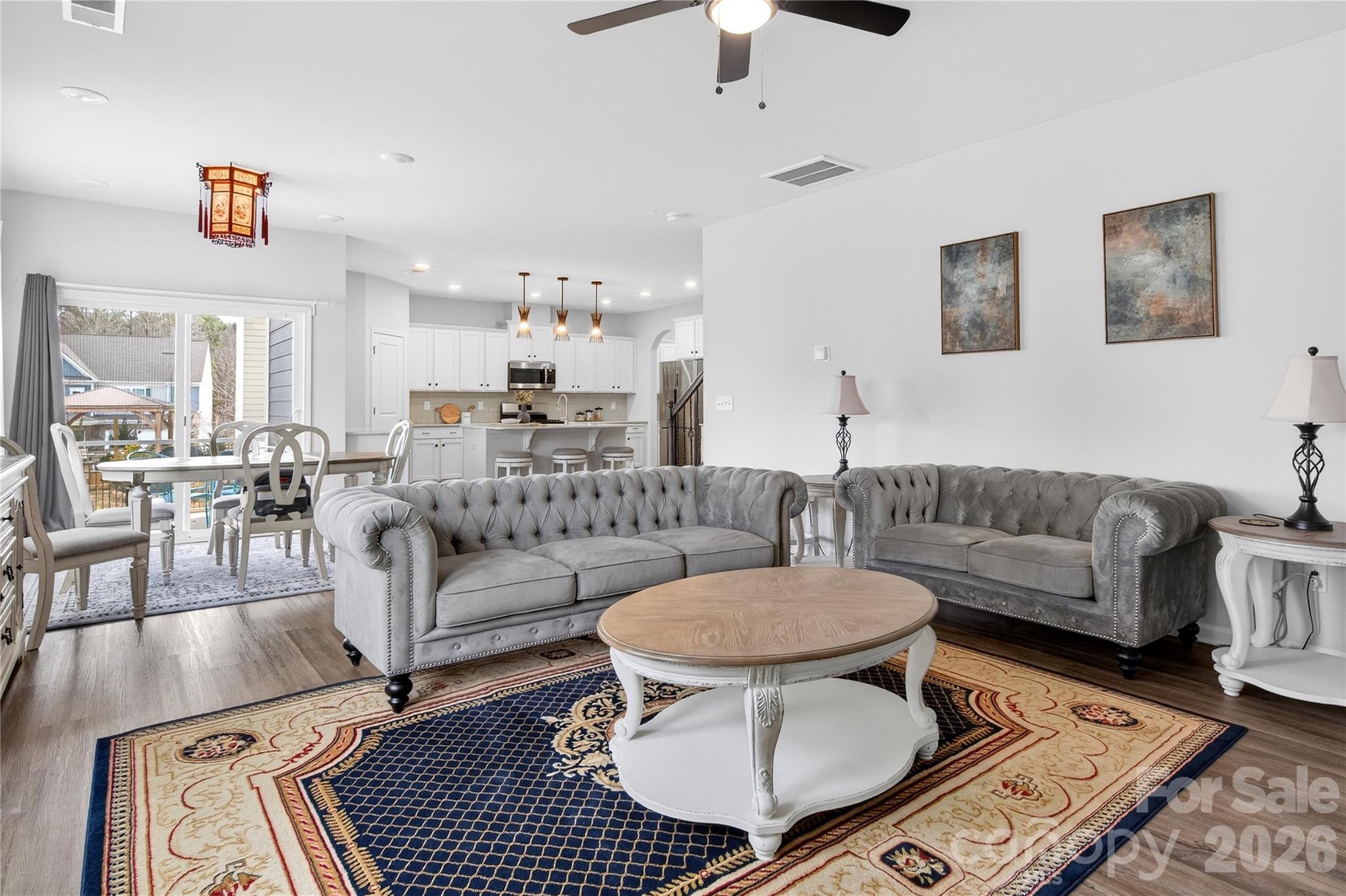 151 Outrigger Lane Troutman, NC 28166 - Photo 21 of 39 a living room with furniture and a dining table