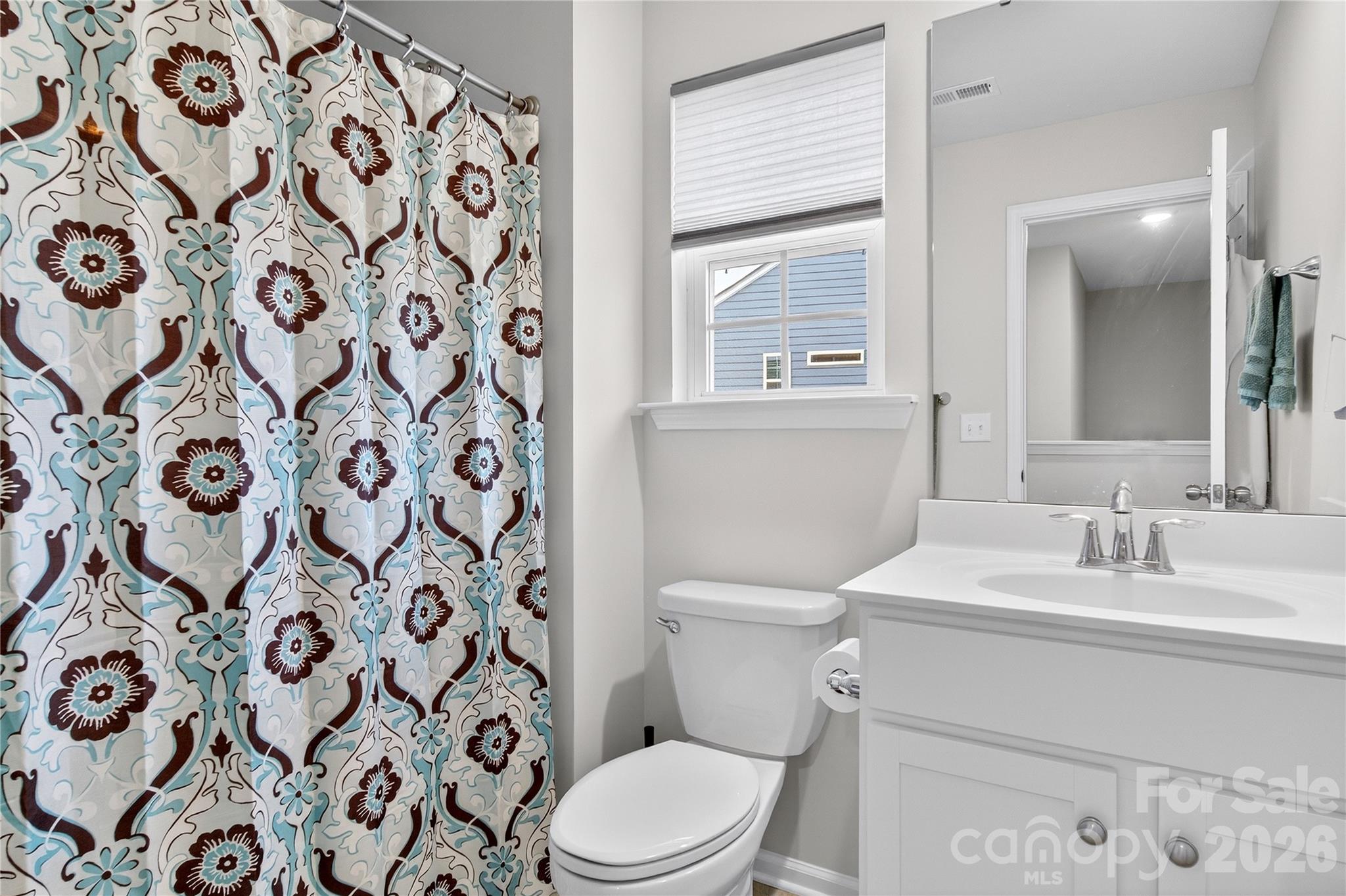 151 Outrigger Lane Troutman, NC 28166 - Photo 24 of 39 a view of bathroom with a toilet sink and a mirror