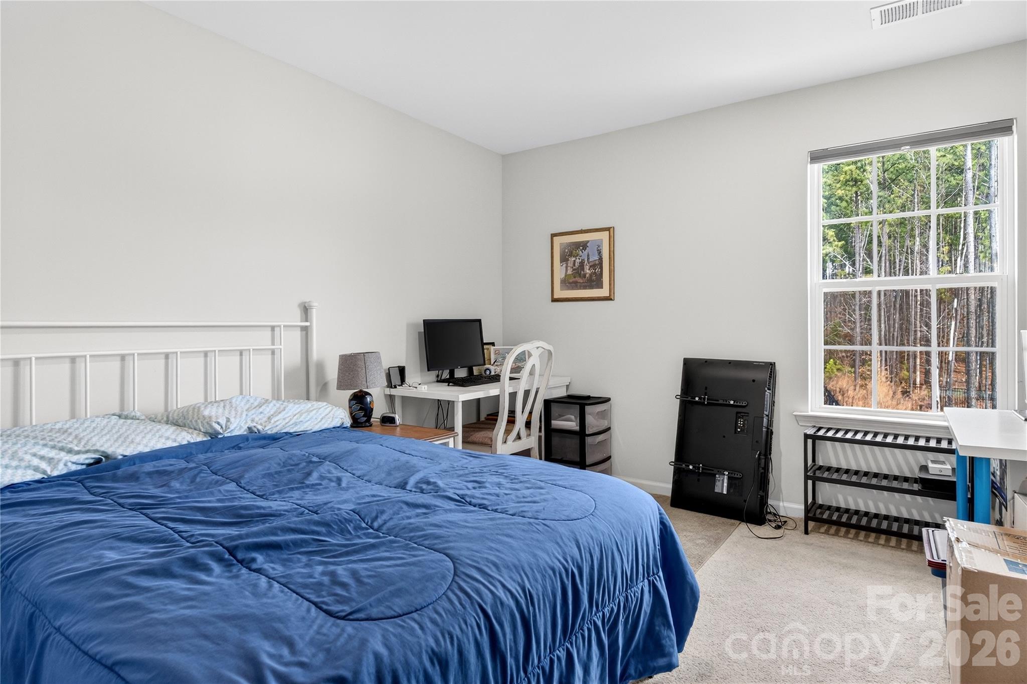 151 Outrigger Lane Troutman, NC 28166 - Photo 25 of 39 a bedroom with a bed and a tv
