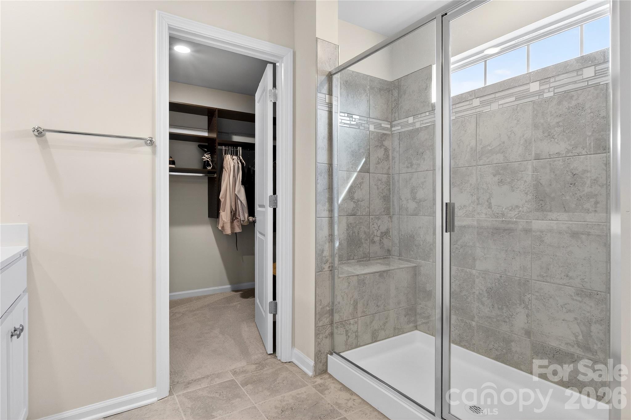 151 Outrigger Lane Troutman, NC 28166 - Photo 33 of 39 a bathroom with a glass shower door