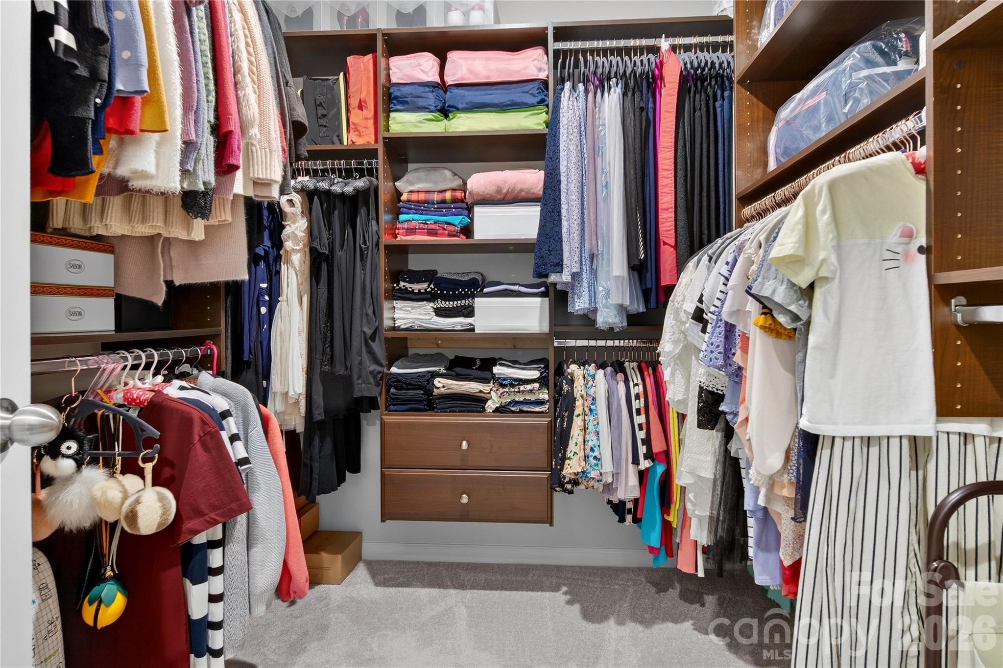 151 Outrigger Lane Troutman, NC 28166 - Photo 35 of 39 a view of walk in closet with clothes and shoes