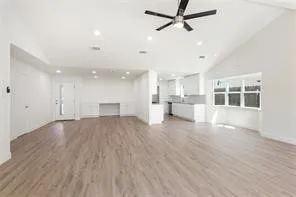 a view of a kitchen with furniture and a window