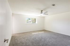 4715 Broken Elm Drive Spring, TX 77388 - Photo 21 of 35 an empty room with windows and fan
