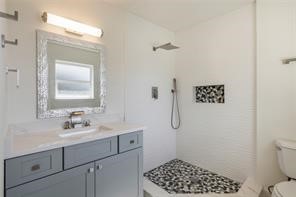 4715 Broken Elm Drive Spring, TX 77388 - Photo 25 of 35 a bathroom with a sink a toilet and shower