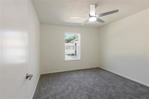 4715 Broken Elm Drive Spring, TX 77388 - Photo 29 of 35 an empty room with a window and a fan
