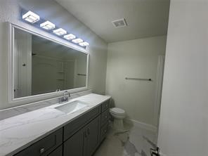 4715 Broken Elm Drive Spring, TX 77388 - Photo 30 of 35 a bathroom with a sink toilet and a mirror