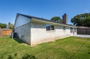 4715 Broken Elm Drive Spring, TX 77388 - Photo 34 of 35 a backyard of a house with table and chairs