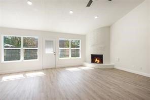 4715 Broken Elm Drive Spring, TX 77388 - Photo 7 of 35 an empty room with wooden floor and a window