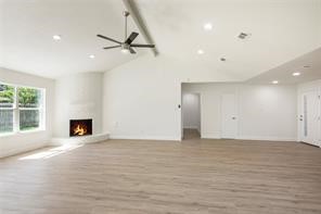 4715 Broken Elm Drive Spring, TX 77388 - Photo 8 of 35 a view of an empty room with a fireplace and a window