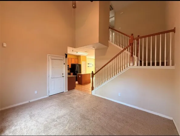 a view of a hallway with staircase