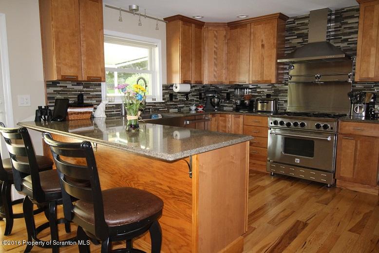 1620 Cortez Road Lake Ariel, PA 18436 - Photo 15 of 80 a kitchen with stainless steel appliances granite countertop a stove a sink and a microwave