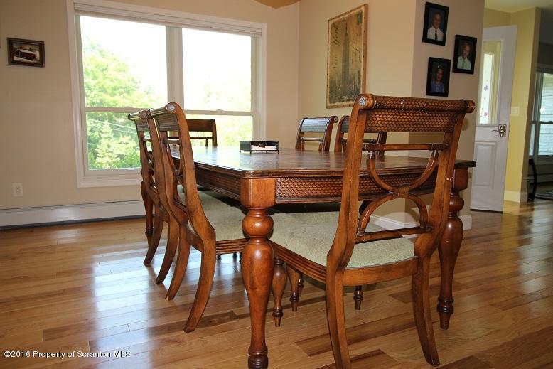 1620 Cortez Road Lake Ariel, PA 18436 - Photo 26 of 80 a view of a dining room with furniture and wooden floor