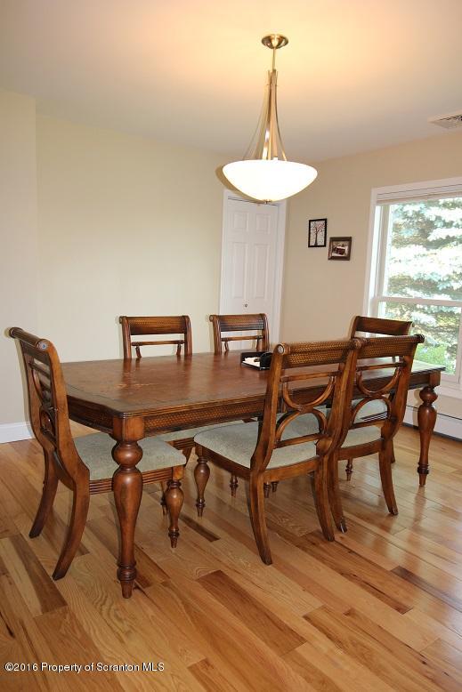 1620 Cortez Road Lake Ariel, PA 18436 - Photo 27 of 80 a view of a dining room with furniture and wooden floor