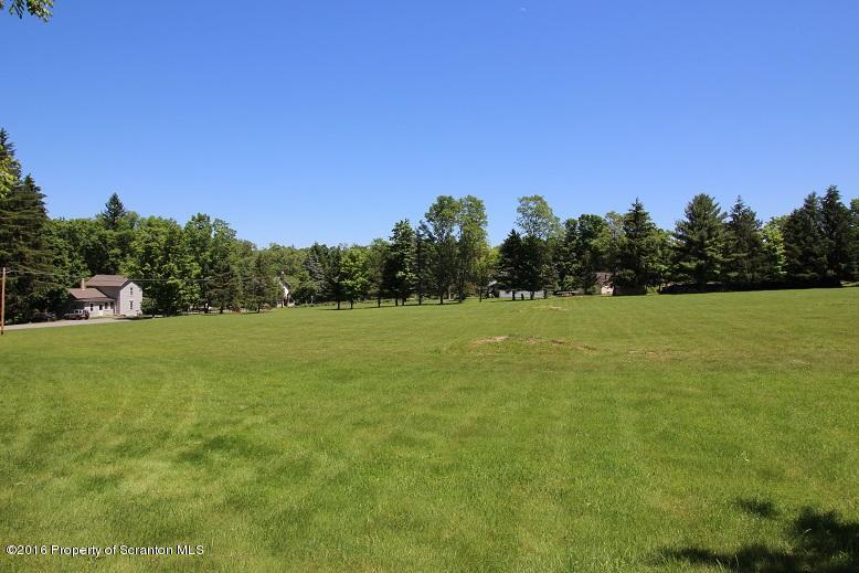 1620 Cortez Road Lake Ariel, PA 18436 - Photo 4 of 80 a view of a field with trees in the background