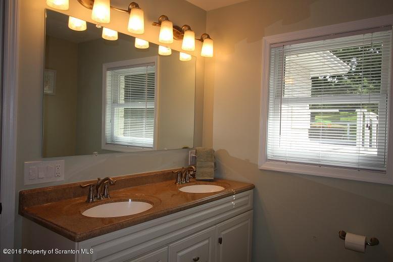 1620 Cortez Road Lake Ariel, PA 18436 - Photo 48 of 80 a bathroom with a sink a vanity and a mirror