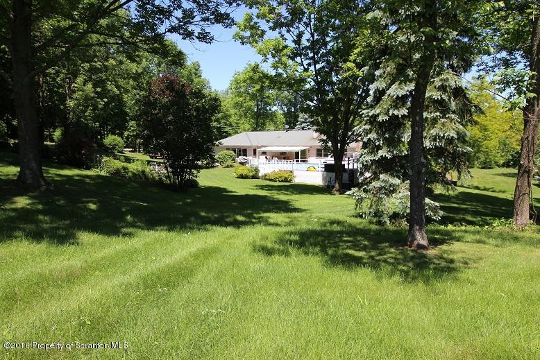 1620 Cortez Road Lake Ariel, PA 18436 - Photo 5 of 80 a backyard of a house with a garden and plants
