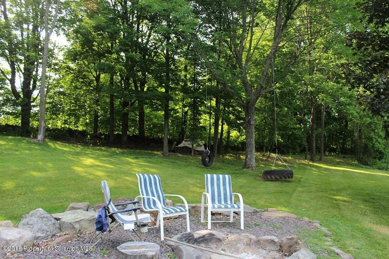 1620 Cortez Road Lake Ariel, PA 18436 - Photo 63 of 80 a view of a table and chairs in the garden