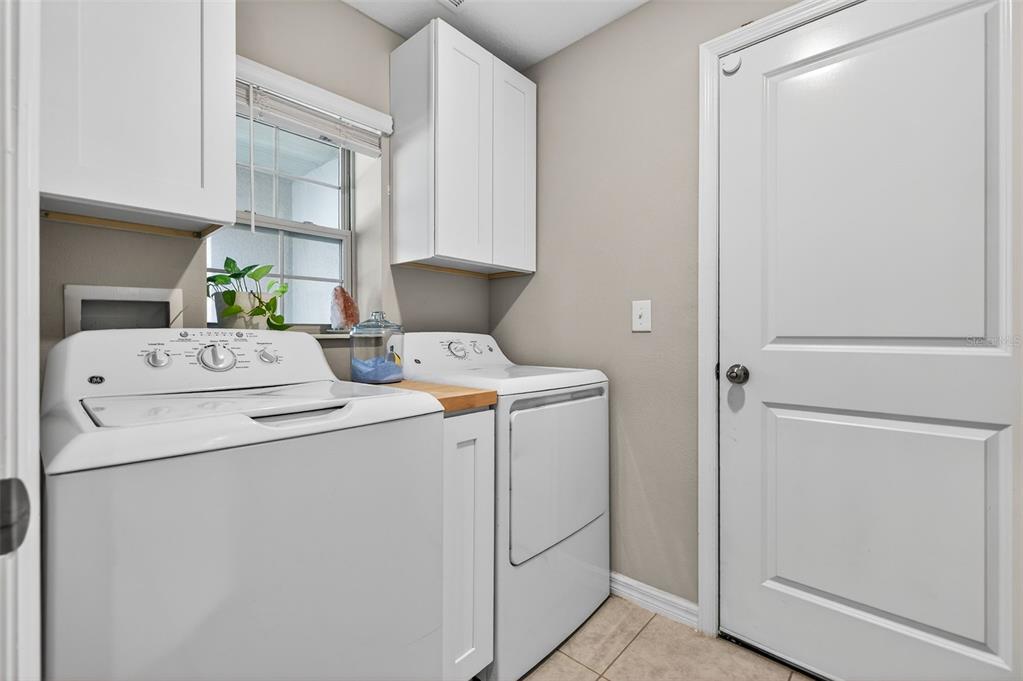 9324 Lemon Drop Loop Sun City Center, FL 33573 - Photo 20 of 32 a utility room with dryer and washer