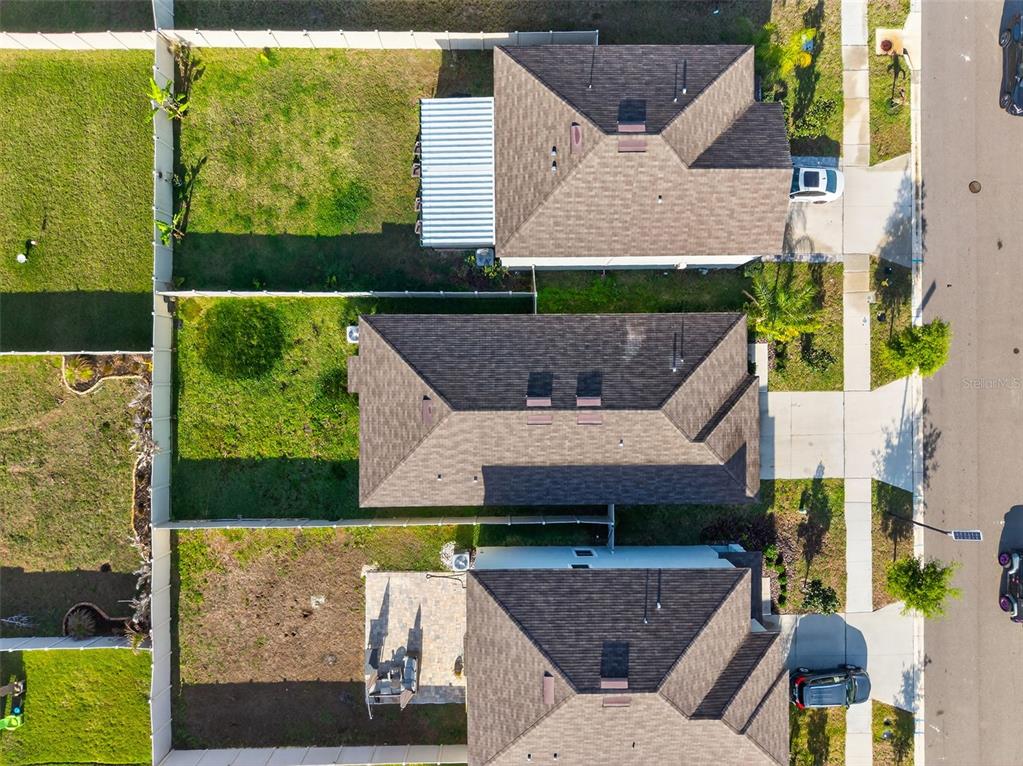 9324 Lemon Drop Loop Sun City Center, FL 33573 - Photo 26 of 32 an aerial view of a house with swimming pool