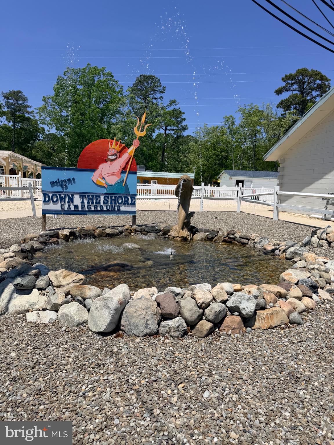 561 Corsons Tavern Road, Unit 43 Ocean View, NJ 08230 - Photo 18 of 18 a view of a lake with an outdoor space