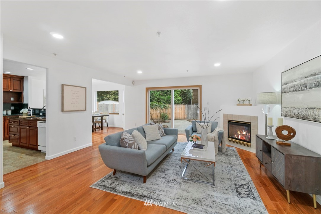 6018 Cady Road Everett, WA 98203 - Photo 2 of 16 a living room with furniture a fireplace and a flat screen tv
