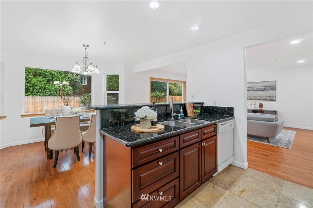 6018 Cady Road Everett, WA 98203 - Photo 5 of 16 a kitchen with a stove cabinets and wooden floor