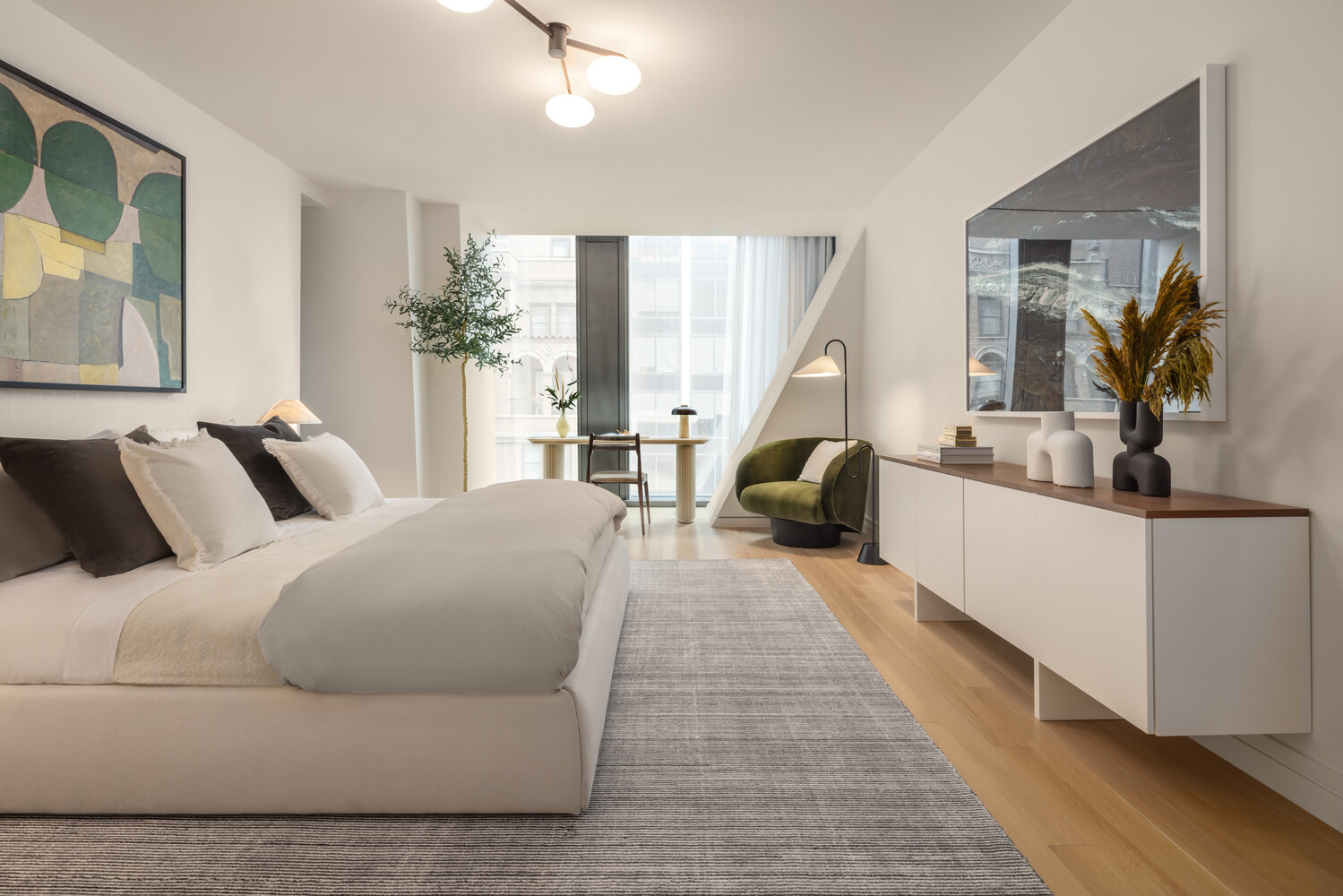 53 West 53rd Street, Unit 19A Manhattan, NY 10019 - Photo 6 of 11 a living room with furniture and a large mirror