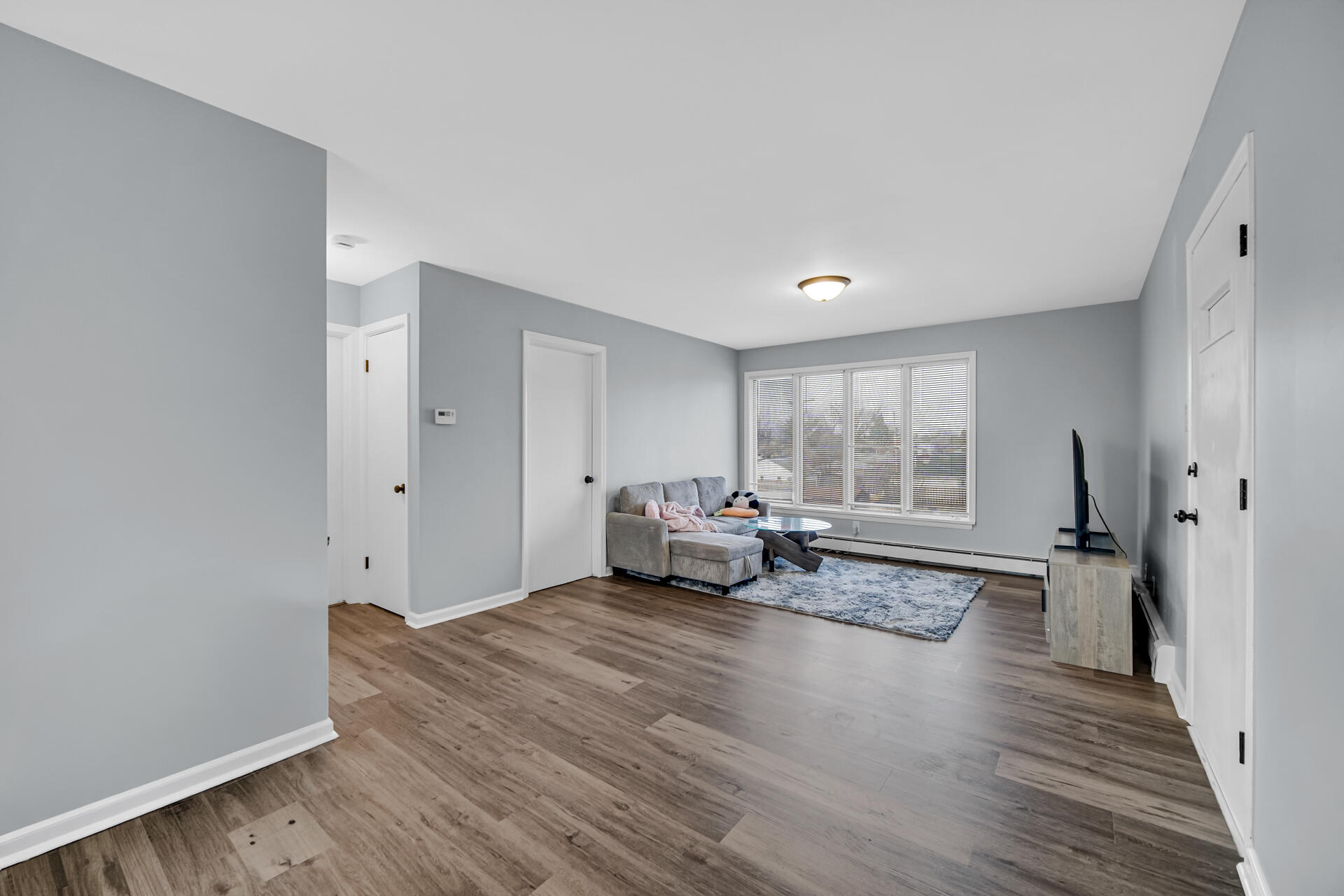 1104 169th Street Hammond, IN 46324 - Photo 8 of 20 a view of a room with wooden floor and furniture