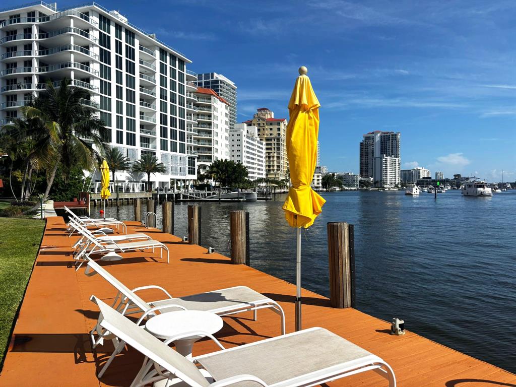 a terrace with outdoor seating and city view