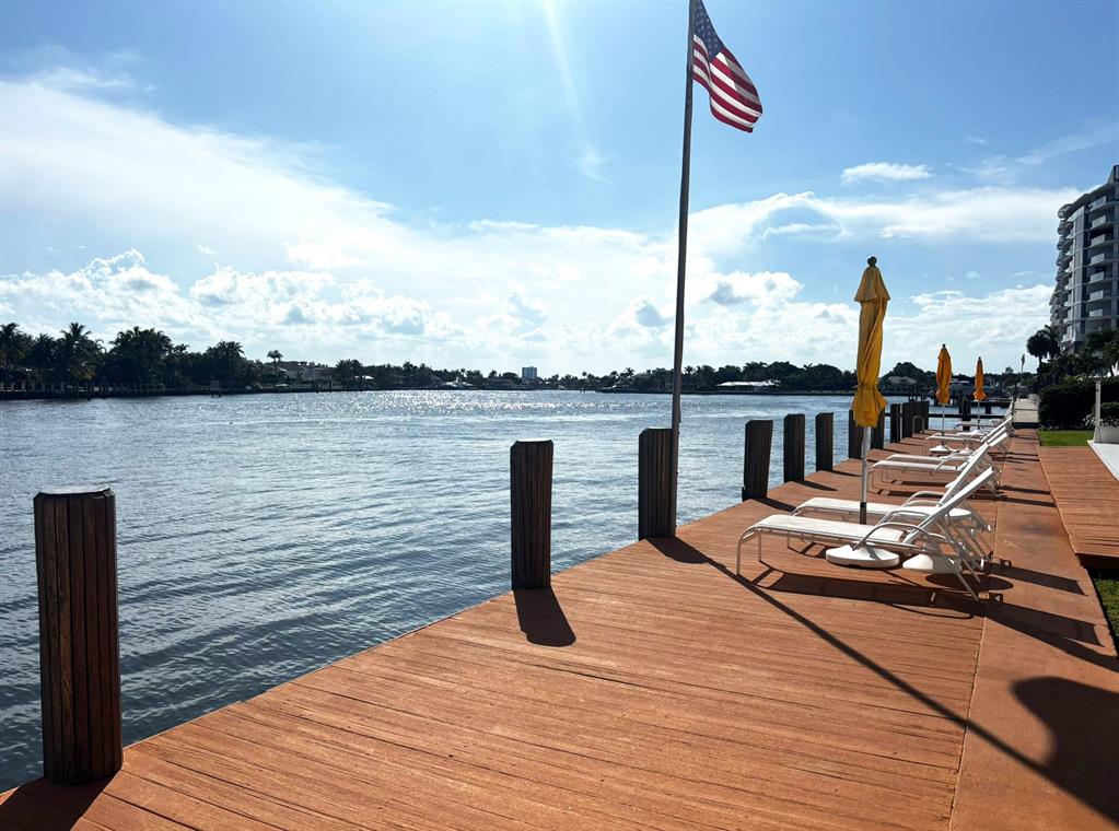 341 North Birch Road, Unit 416 Fort Lauderdale, FL 33304 - Photo 12 of 49 a wooden deck with lake view
