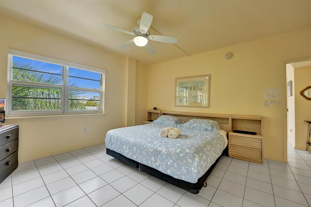 341 North Birch Road, Unit 416 Fort Lauderdale, FL 33304 - Photo 19 of 49 a bedroom with a bed and a window