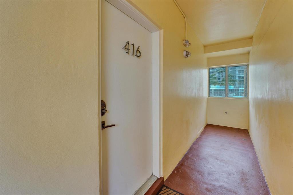 341 North Birch Road, Unit 416 Fort Lauderdale, FL 33304 - Photo 20 of 49 a view of a hallway with wooden floor