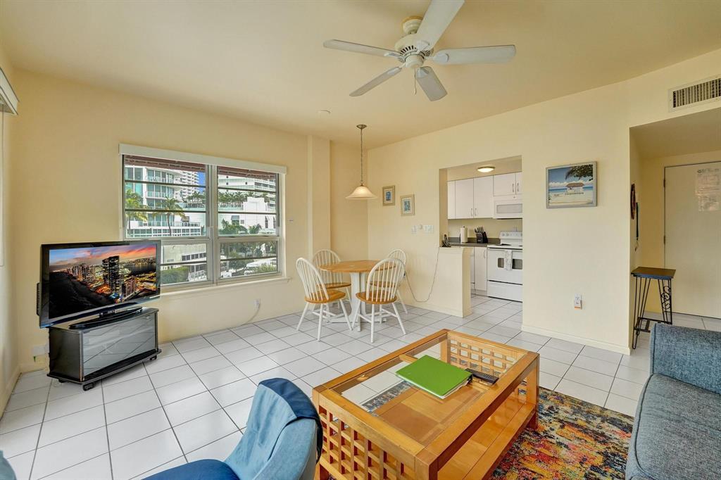 341 North Birch Road, Unit 416 Fort Lauderdale, FL 33304 - Photo 25 of 49 a living room with furniture and a table