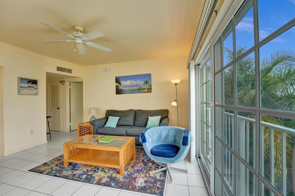 341 North Birch Road, Unit 416 Fort Lauderdale, FL 33304 - Photo 28 of 49 a living room with furniture and a rug