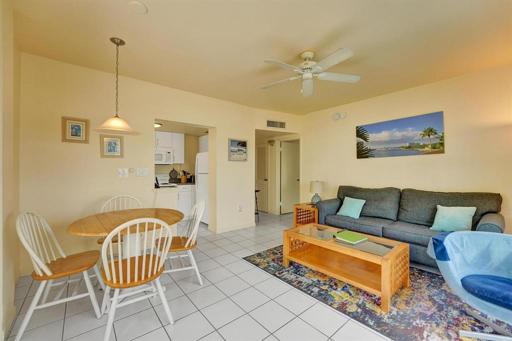 341 North Birch Road, Unit 416 Fort Lauderdale, FL 33304 - Photo 30 of 49 a living room with furniture and a chandelier