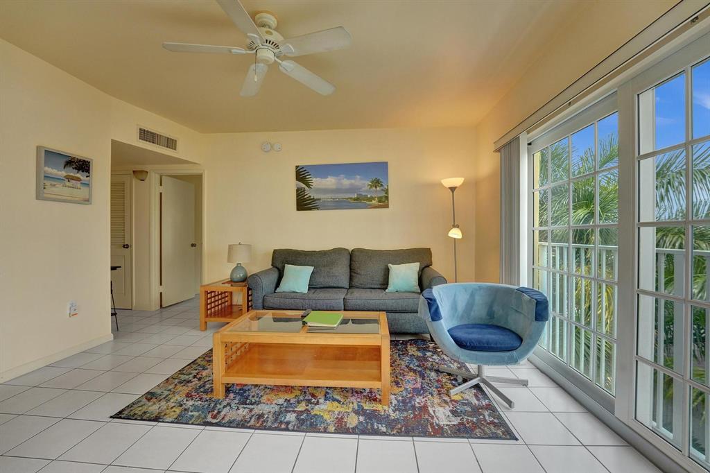 341 North Birch Road, Unit 416 Fort Lauderdale, FL 33304 - Photo 33 of 49 a living room with furniture and a rug