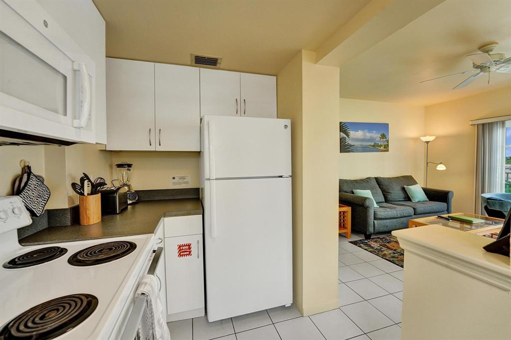 341 North Birch Road, Unit 416 Fort Lauderdale, FL 33304 - Photo 38 of 49 a kitchen with a refrigerator and a stove top oven