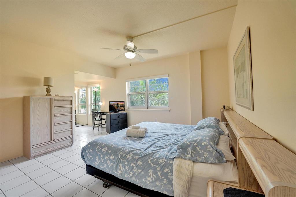 341 North Birch Road, Unit 416 Fort Lauderdale, FL 33304 - Photo 39 of 49 a spacious bedroom with a bed a window and walk in closet