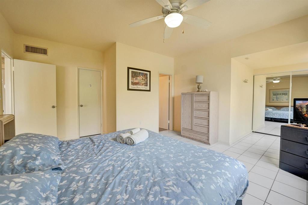 341 North Birch Road, Unit 416 Fort Lauderdale, FL 33304 - Photo 41 of 49 a view of a bedroom with cabinet and bathroom