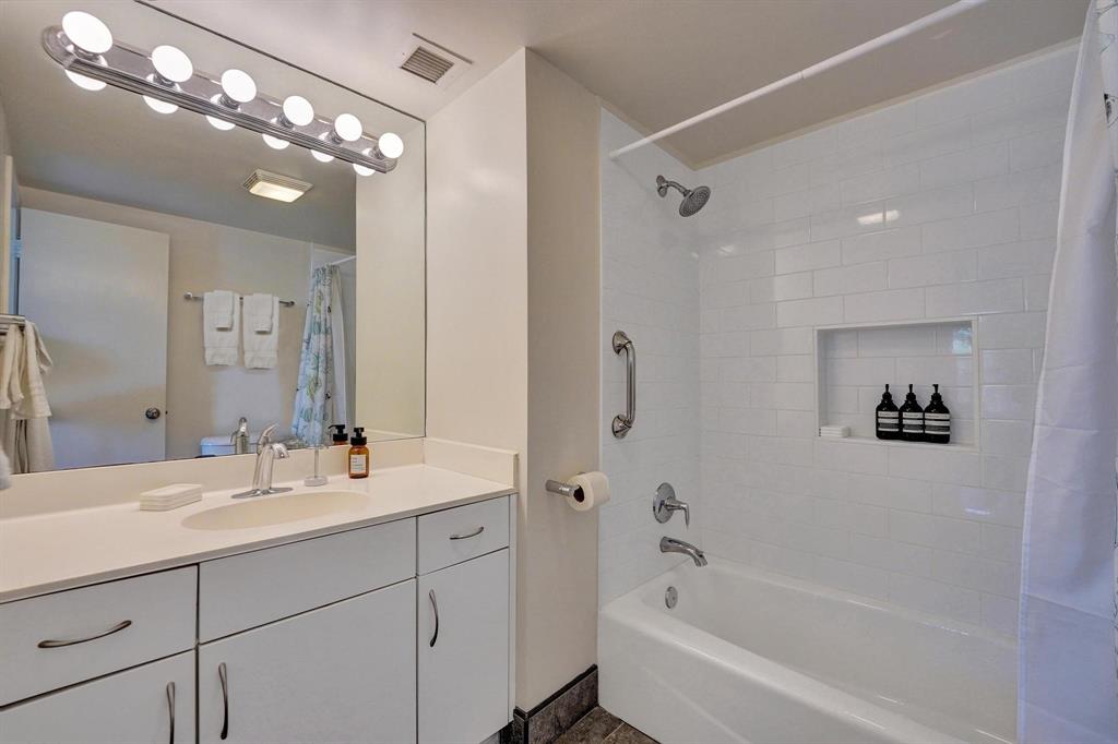 341 North Birch Road, Unit 416 Fort Lauderdale, FL 33304 - Photo 46 of 49 a bathroom with a double vanity sink mirror and shower