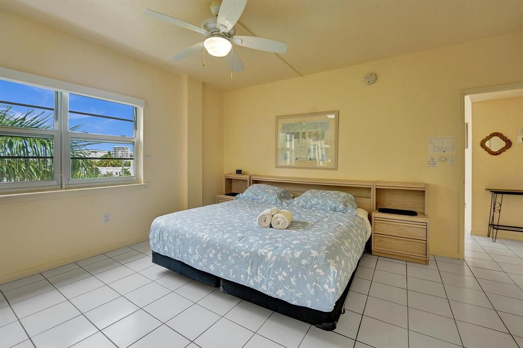 341 North Birch Road, Unit 416 Fort Lauderdale, FL 33304 - Photo 47 of 49 a bedroom with a bed and a window