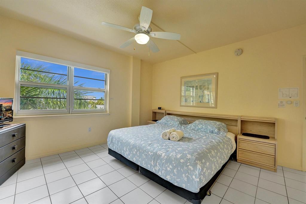 341 North Birch Road, Unit 416 Fort Lauderdale, FL 33304 - Photo 48 of 49 a bedroom with a bed and a window