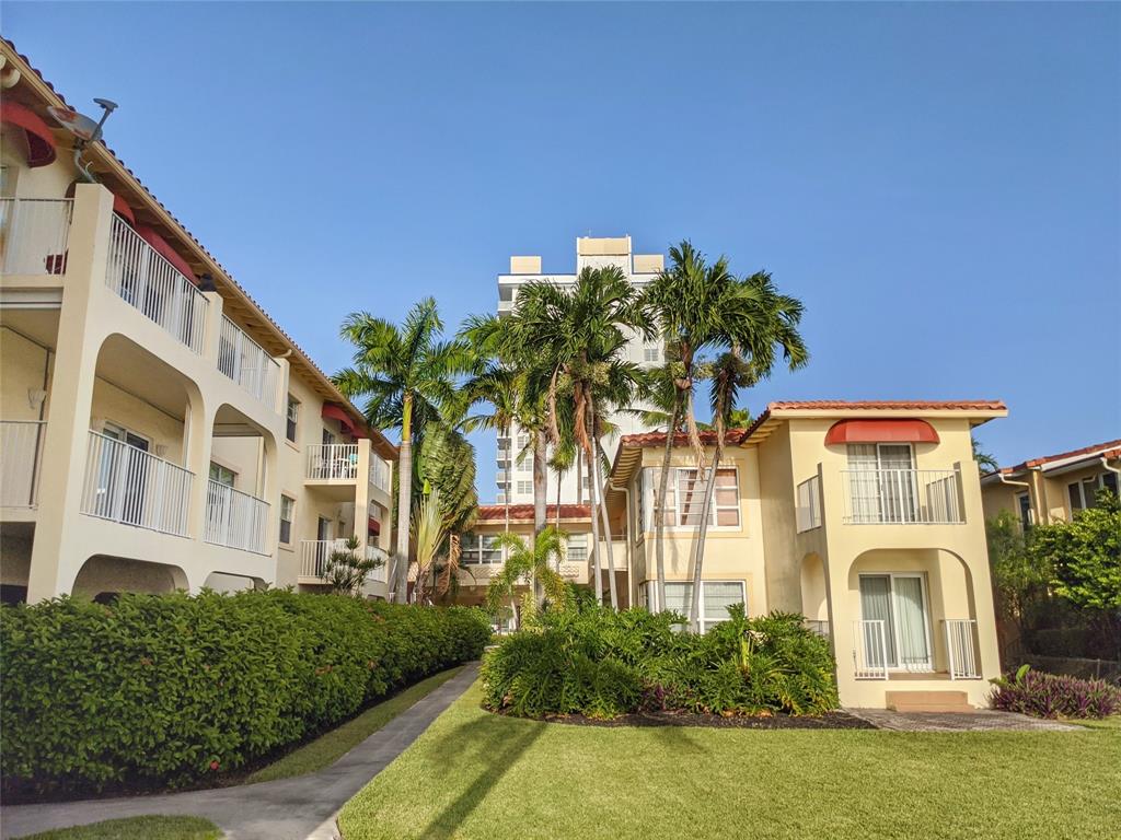 341 North Birch Road, Unit 416 Fort Lauderdale, FL 33304 - Photo 7 of 49 a front view of a house with a yard