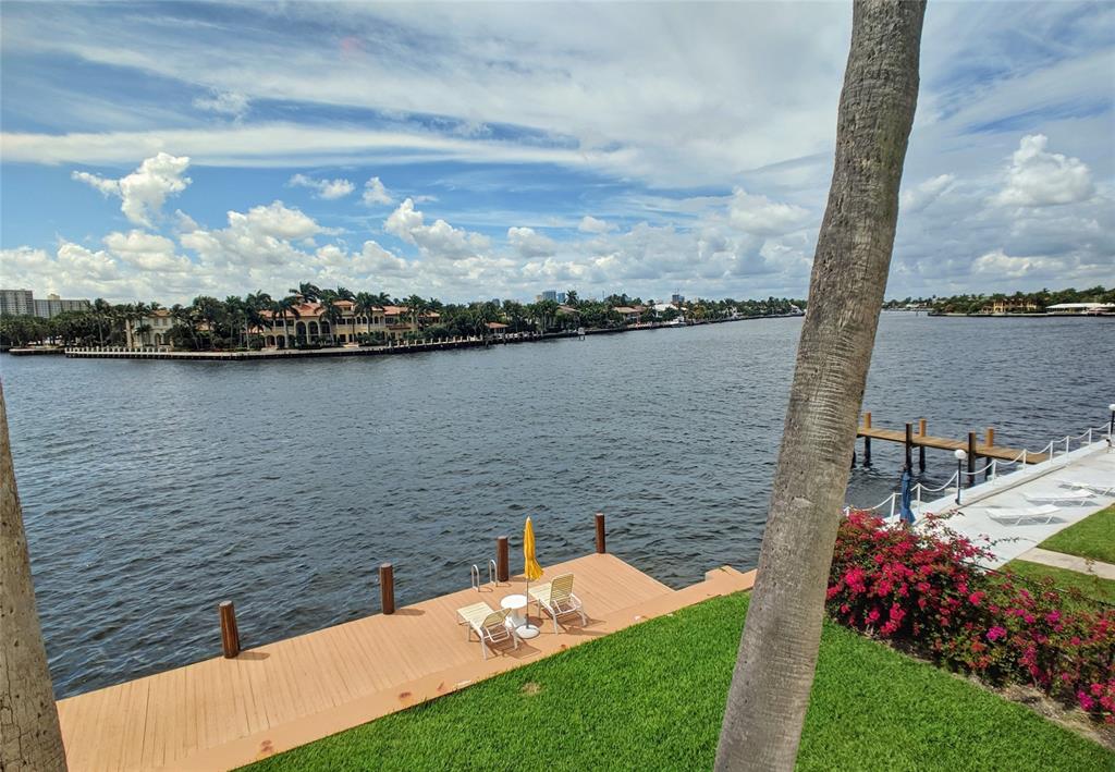 341 North Birch Road, Unit 416 Fort Lauderdale, FL 33304 - Photo 8 of 49 a view of a lake with a garden