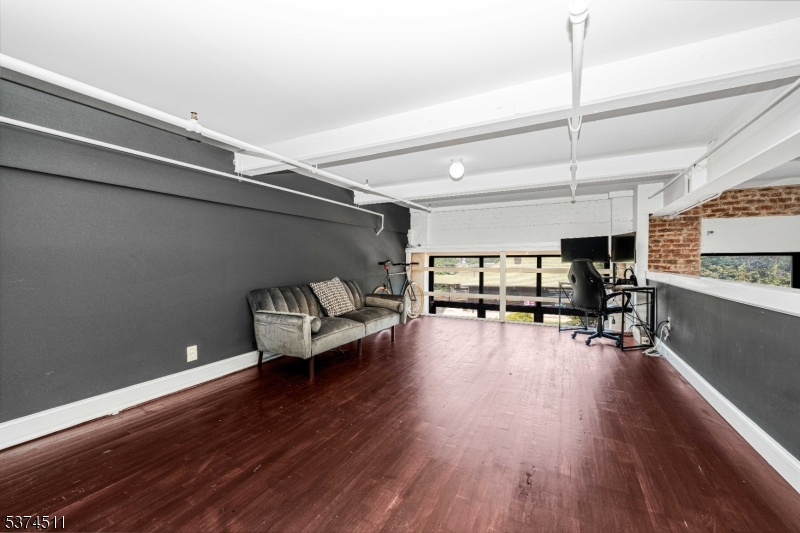 350 Scotland Road Orange, NJ 07050 - Photo 11 of 18 a living room with furniture and a wooden floor