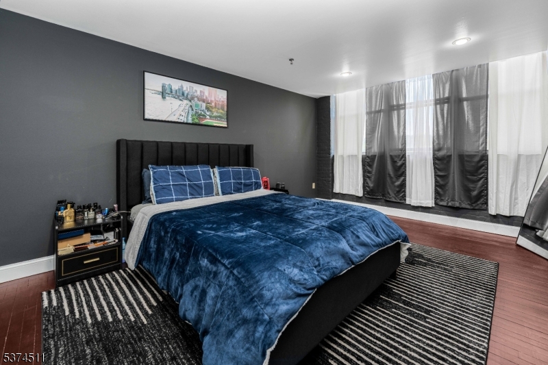 350 Scotland Road Orange, NJ 07050 - Photo 13 of 18 a bedroom with bed and wooden floor