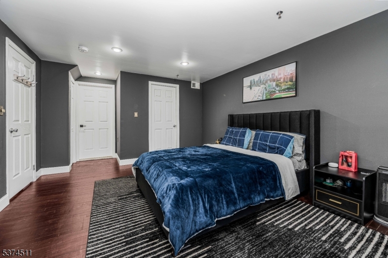 350 Scotland Road Orange, NJ 07050 - Photo 14 of 18 a bedroom with bed and a night stand