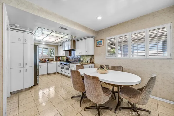 a kitchen with stainless steel appliances kitchen island granite countertop a sink and cabinets
