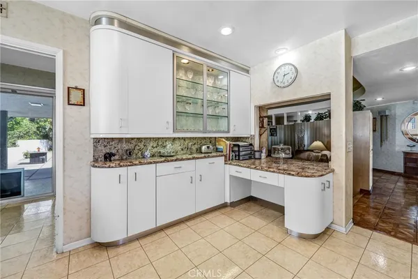a kitchen with a sink and refrigerator